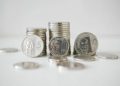 Peso inches up before key US inflation report