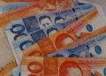 Peso inches up on dovish Fed