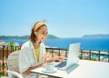 Two in five UK workers continue checking emails on holiday, with top earners working up to three days