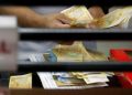 Peso surges to P57 level on remittances