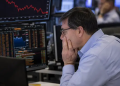 FTSE 100 edges higher as investors balance financial recovery and AI risks